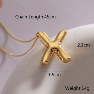 Detail of golden balloon letter X pendant with size measurements 45cm chain and 2.1cm height