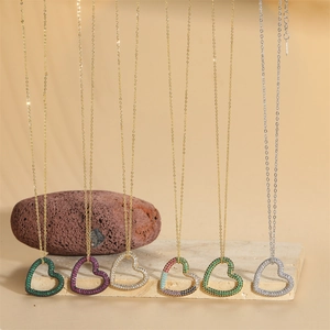 Minimalist gold and silver heart pendants with micro-pave colorful cubic zirconia stones