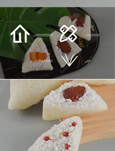 Macro detail of realistic PVC zongzi food models showing rice texture and red bean fillings