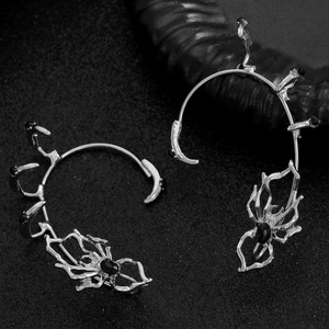 Silver spider ear cuffs with black rhinestones in a dark gothic punk aesthetic