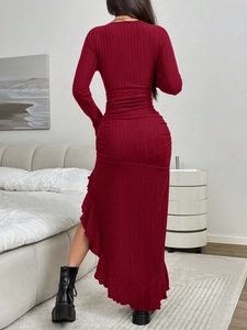 Detail of burgundy ribbed knit dress showing elegant ruffles and slim fit texture
