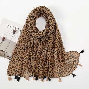 Fashionable leopard print scarf with fringe tassels and soft linen-feel texture for women
