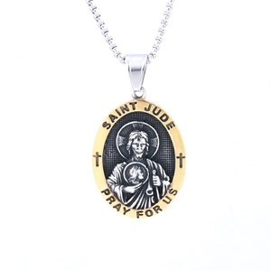 Macro detail of oval Saint Jude relief pendant in two-tone silver and gold plating