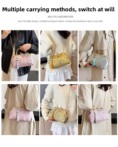 Detail showing multiple ways to wear the Chinese style embroidered shell bag with chain