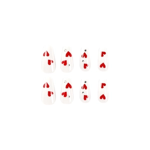 Medium length white press-on nails with red heart patterns and sparkling rhinestones