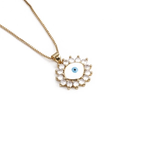 Golden evil eye necklace with blue zircon inlay and sparkling cubic zirconia stones