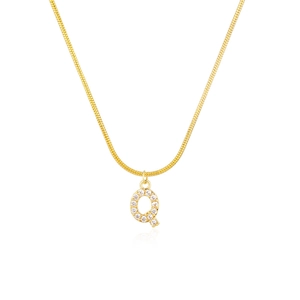 Close-up of golden snake chain necklace with sparkling letter Q pendant and inlaid crystals