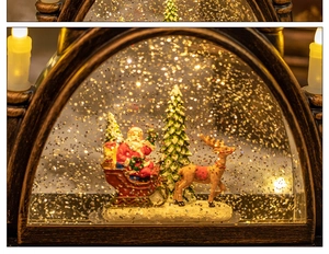 Detailed view of Christmas snow globe with Santa Claus, reindeer, and warm LED lighting