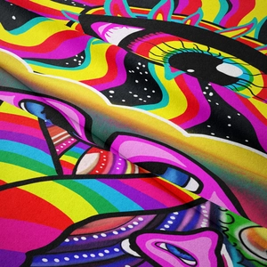 Detail of psychedelic mushroom tapestry showing high-definition eye pattern and soft fabric texture