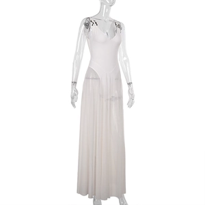 Detailed view of white V-neck mesh dress featuring black shoulder buckles and pleated tulle