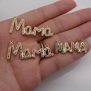 Gold-plated Mama letter pendant with micro-paved cubic zirconia stones on a hand