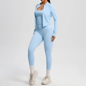 Three-piece light blue yoga set with zipper jacket, sports bra, and high-waist leggings