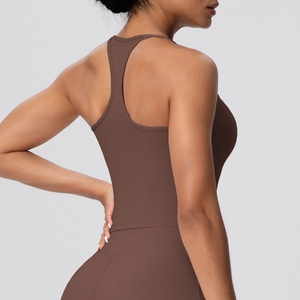 Detail of the dark brown racerback sports bra and high-waist leggings on a female model