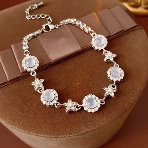 Exquisite silver floral bracelet with light blue chalcedony stones and micro zircons