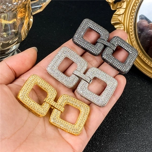 Detailed view of rectangle interlocking jewelry clasps with zircon in gold silver black