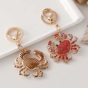 Sparkling crystal ocean crab keychain pair with red rhinestones and gold alloy plating