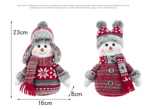 Detailed view of plush Christmas snowman figurines showing 23cm height and 16cm width specs