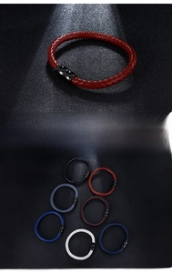 Close-up of woven leather bracelets with black magnetic steel clasps in multiple colors