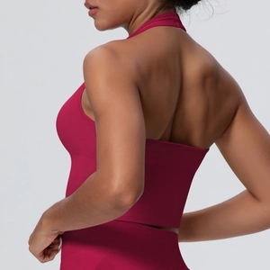 Close-up of deep red high-impact sports bra featuring an open back and knit texture