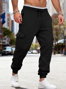 Close-up of cargo jogger with drawstring waist, side flap pockets, and ribbed ankle cuffs