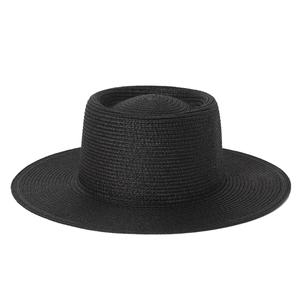 Detailed close-up of a black boater hat featuring fine spiral woven texture and flat top