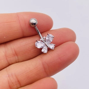 Macro view of silver stainless steel butterfly belly ring with marquise zircon stones