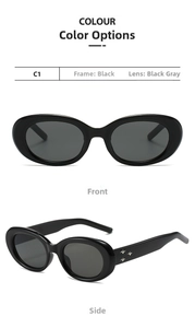 Close-up of black oval sunglasses with three silver star rivets on the side temple