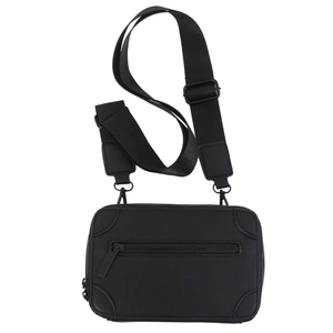 Minimalist black messenger bag with adjustable nylon strap and reinforced leather corners