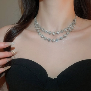Elegant double-layered floral pendant necklace with diamonds on model neck