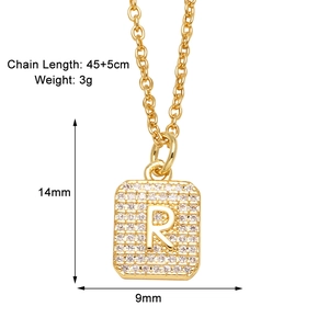 Detail of gold letter R pendant with cubic zirconia inlay and measurements