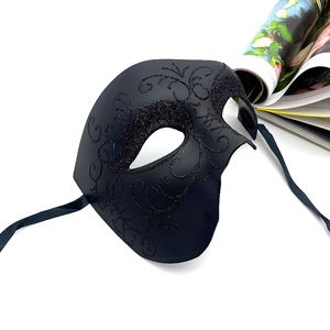 Phantom of the opera mask in black with glitter pattern and silk ribbons on white
