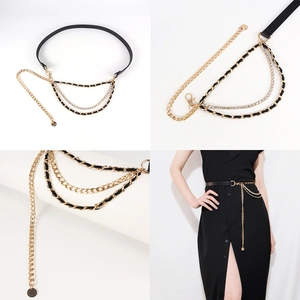 Detail of multi-layer gold chain belt with leather weave and rhinestone accents for dresses