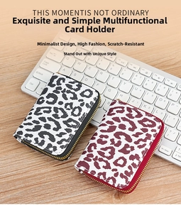 Detailed close-up of leopard print card holders with anti-scratch texture and metal zippers
