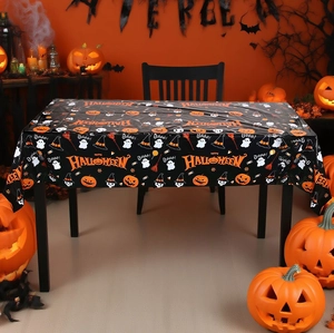 Detail of Halloween PE tablecloth featuring orange pumpkins, ghosts, and spooky text patterns