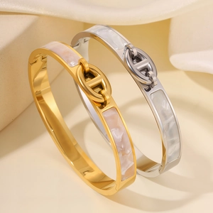 Polished titanium steel bracelets with mother of pearl inlay in gold and silver finish