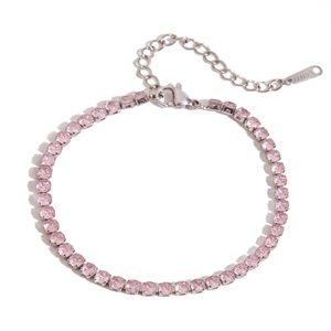 Detail of silver stainless steel tennis bracelet with round pink zircon stones and tag