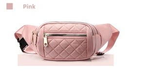 Detailed close-up of pink quilted waist bag featuring diamond stitching and metal zippers