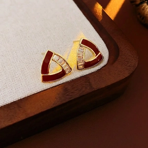 Elegant geometric triangular gold earrings with retro red glaze and sparkling crystals