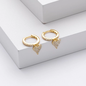 Detailed close-up of S925 sterling silver heart hoop earrings with white zircon accents