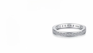 Macro shot of S925 sterling silver eternity band featuring princess cut high carbon diamonds