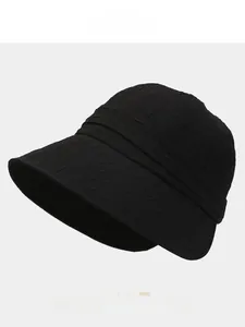 Detail of black seersucker bucket hat showing textured fabric and color palette options