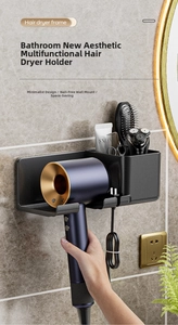 Wall-mounted matte black hairdryer holder with integrated storage box and cable hook
