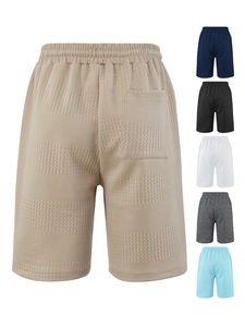 Detail showing waffle texture and color options of men's casual shorts with elastic waist