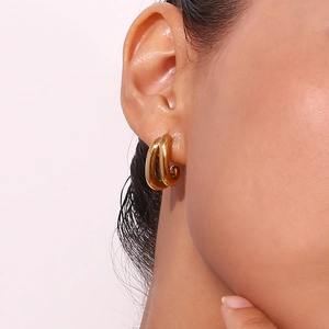 Close-up of double layered 18K gold plated stainless steel hoop earrings on model