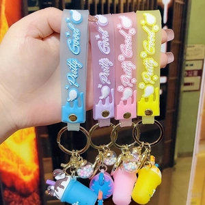 Creative silicone wristband keychain with milk tea cup charms in four vibrant colors