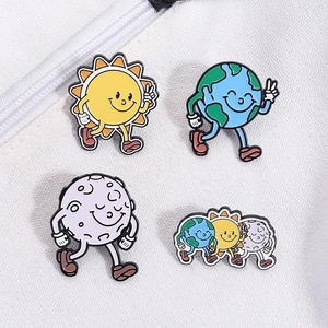 Detailed flat lay of colorful cartoon solar system enamel pins on white texture cloth