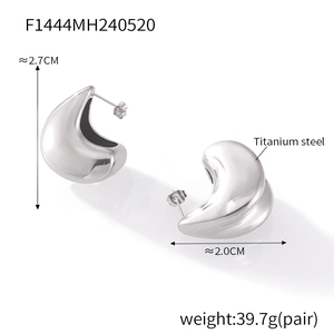 Detailed view of silver titanium steel earrings with double teardrop layered design