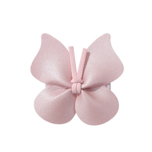 Detailed view of a pink butterfly hair clip featuring high-quality lychee grain leather