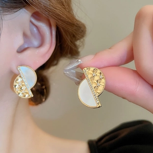 French style semicircular interlocking earrings with mother of pearl and quilted gold