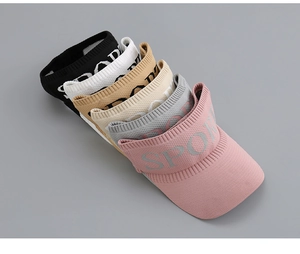 Detail showing various colors of knitted open top sport visors with letter embroidery